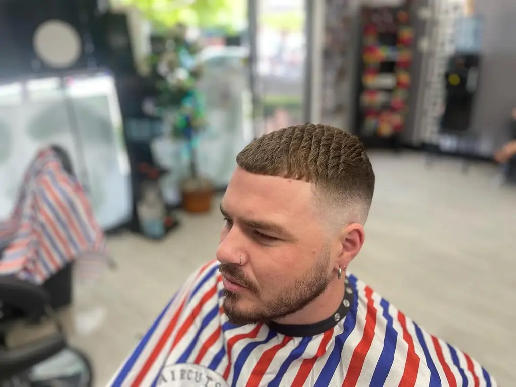 Customer with a textured crop and skin fade in the chair at Royal Fade Barbers, West Perth