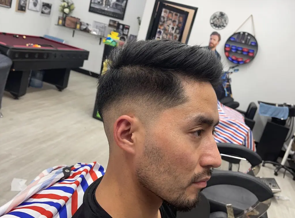 Barber finishing a skin fade at Royal Fade Barbers, West Perth