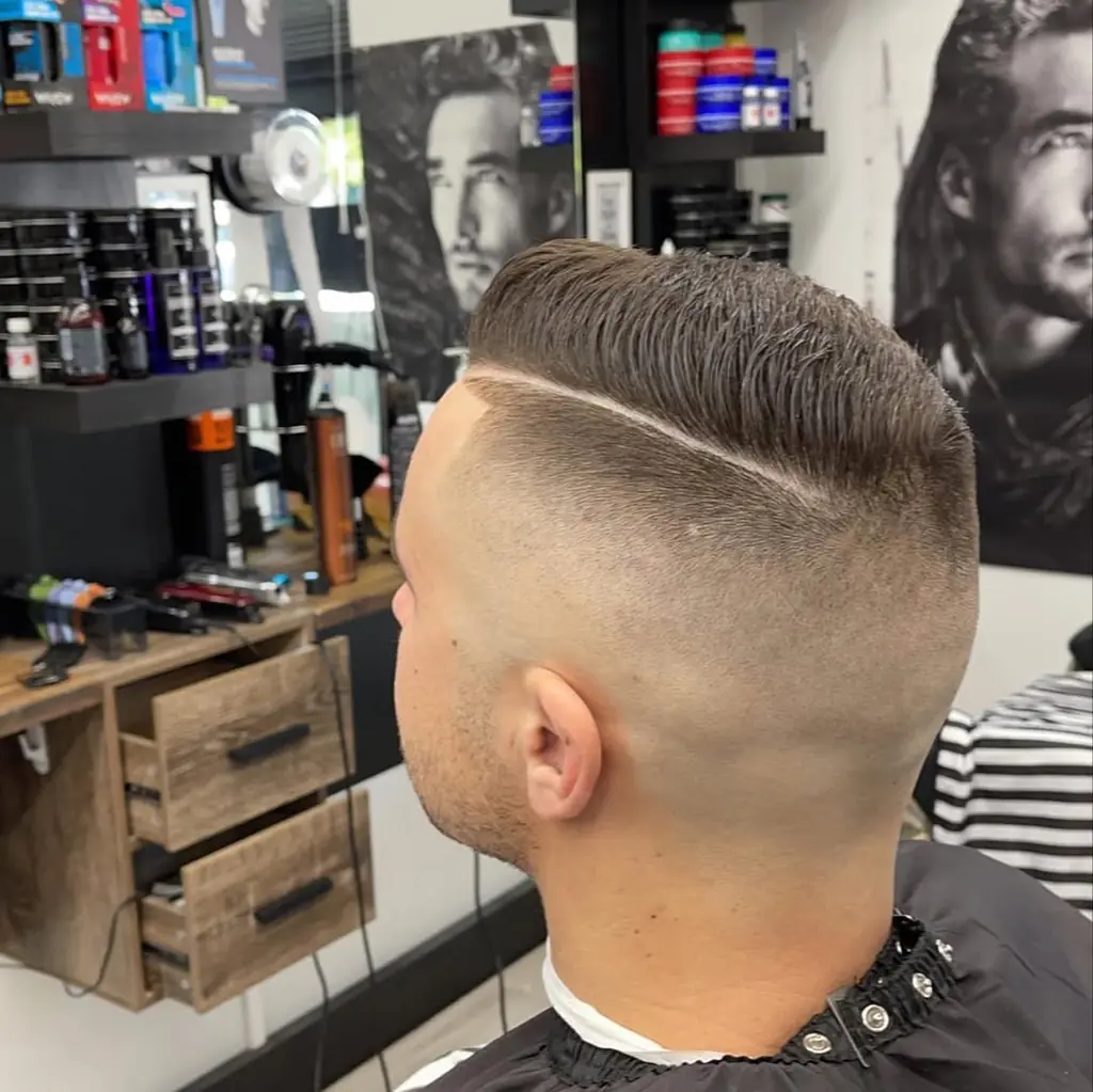 High skin fade with a shaved side part at Royal Fade Barbers, West Perth