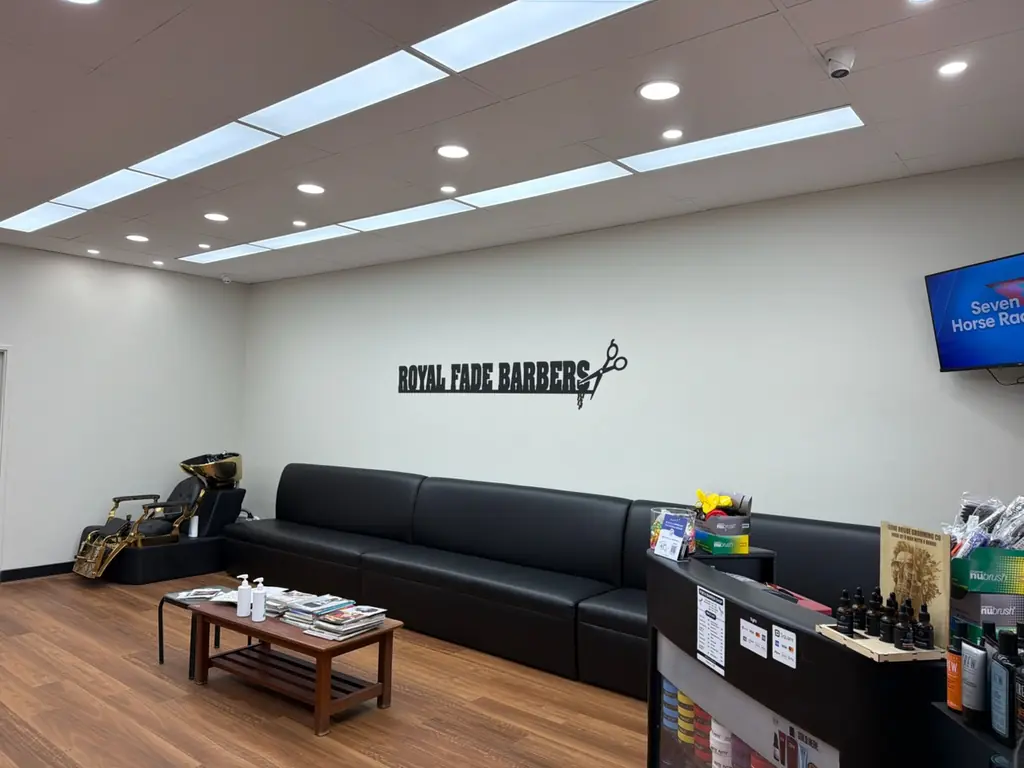 Waiting area and Royal Fade Barbers signage inside the renovated West Perth barbershop
