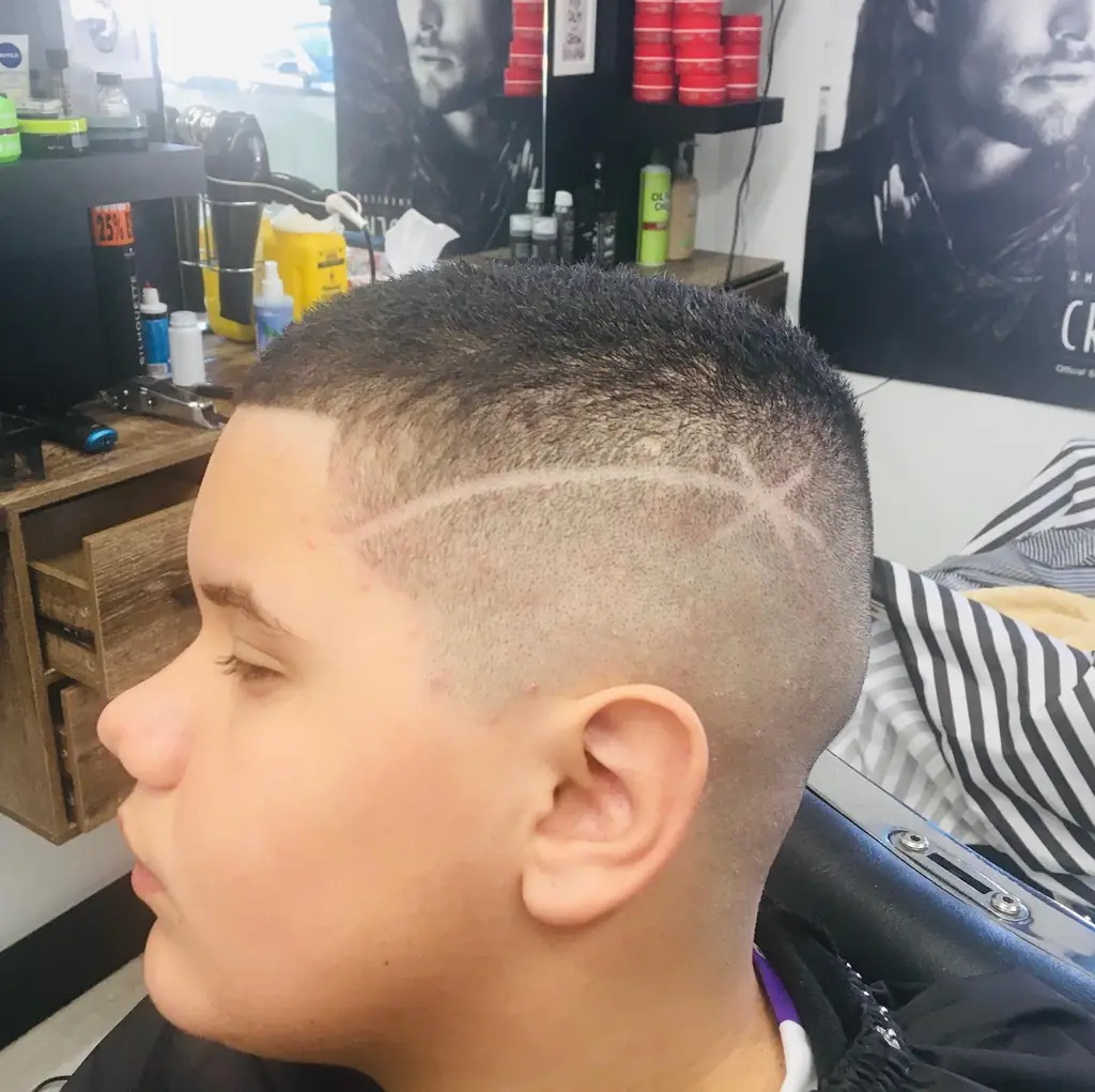 Freehand shaved hair design cut into a skin fade at Royal Fade Barbers